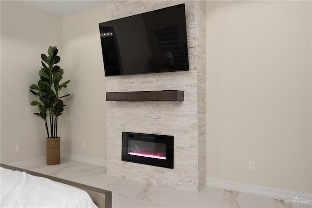 bedroom featuring a fireplace