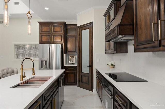 kitchen with appliances with stainless steel finishes, ornamental molding, dark brown cabinets, sink, and pendant lighting