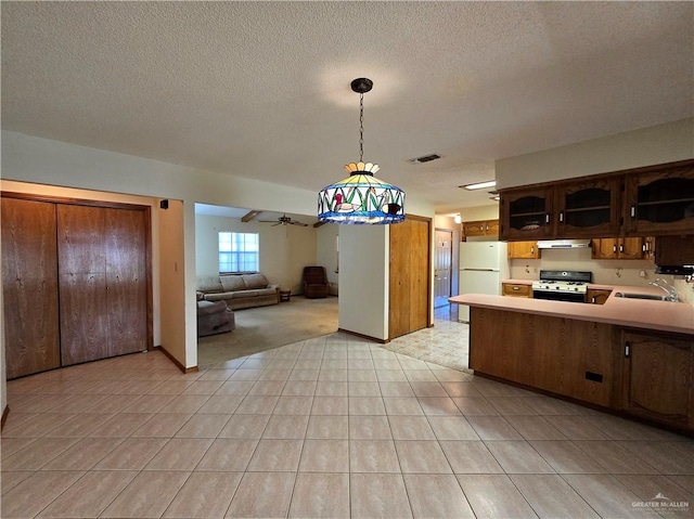 2028 Loker St, Mission, TX 78572 - kitchen featuring white appliances, a sink, open floor plan, light countertops, and ceiling fan