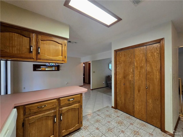 2028 Loker St, Mission, TX 78572 - kitchen with light countertops and brown cabinets
