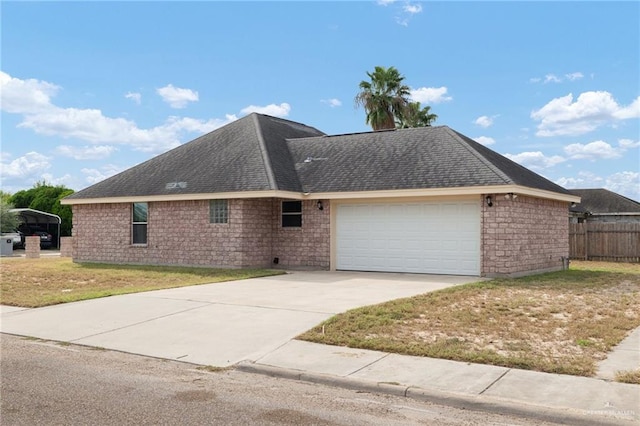 view of side of property with a garage and a lawn