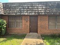 303 Forest Hills Dr Unit 17, Weslaco, TX 78596 - doorway to property featuring brick siding