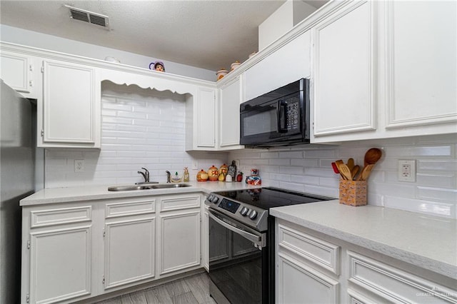 3004 Diaz Ave, Mcallen, TX 78503 - kitchen featuring appliances with stainless steel finishes, a sink, light countertops, and a textured ceiling