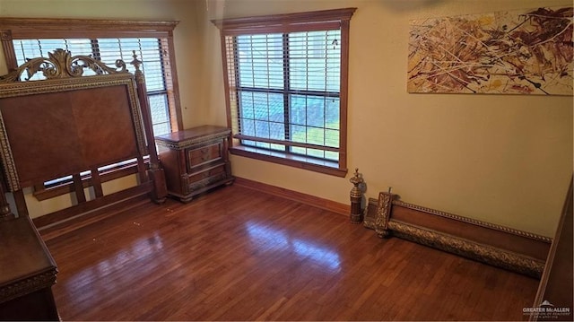 409 Redwood Ave, Mcallen, TX 78501 - empty room featuring wood finished floors and baseboards