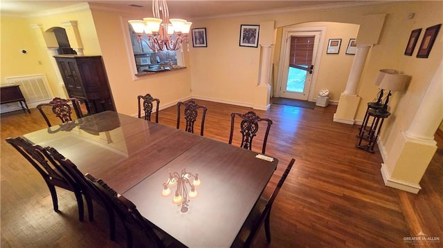 409 Redwood Ave, Mcallen, TX 78501 - dining room featuring arched walkways, decorative columns, crown molding, baseboards, and wood finished floors