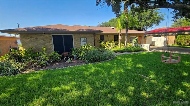 409 Redwood Ave, Mcallen, TX 78501 - back of property with brick siding and a lawn