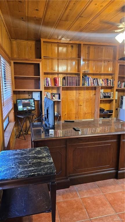 409 Redwood Ave, Mcallen, TX 78501 - office featuring wooden ceiling, wooden walls, a ceiling fan, built in shelves, and tile patterned floors