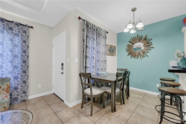 107 E Pike St Unit 2, South Padre Island, TX 78597 - dining room featuring light tile patterned floors, a chandelier, and baseboards