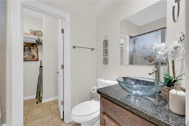 107 E Pike St Unit 2, South Padre Island, TX 78597 - bathroom with vanity, toilet, tile patterned flooring, and a shower with curtain