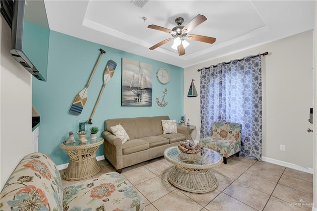 107 E Pike St Unit 2, South Padre Island, TX 78597 - tiled living area with a tray ceiling, a ceiling fan, and baseboards