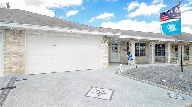 single story home featuring a garage