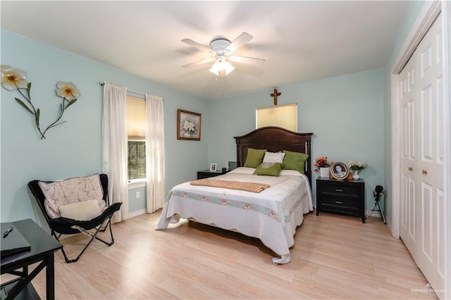 bedroom featuring light hardwood / wood-style flooring, a closet, and ceiling fan