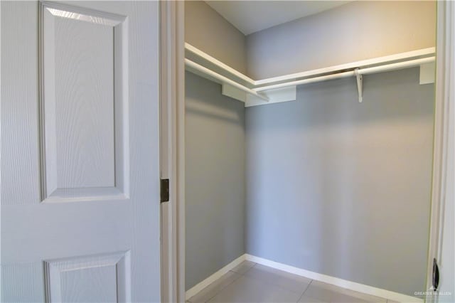 walk in closet featuring light tile patterned floors