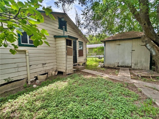 exterior space with a shed