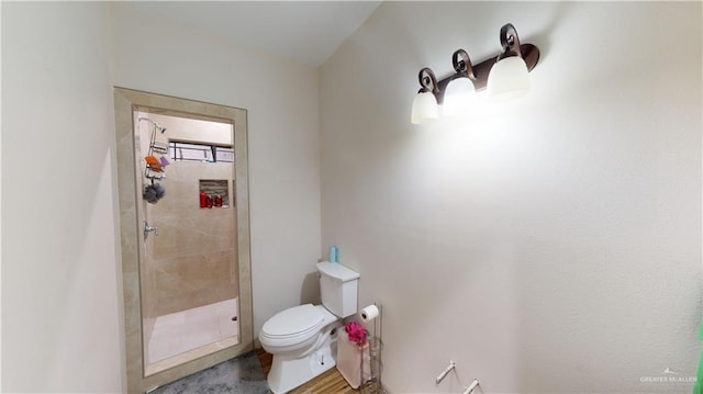 bathroom featuring toilet and walk in shower