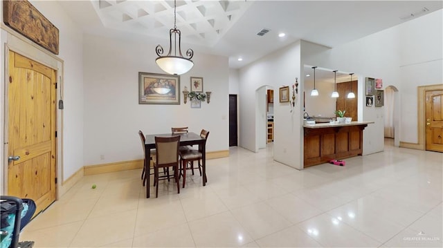 dining space with light tile patterned floors