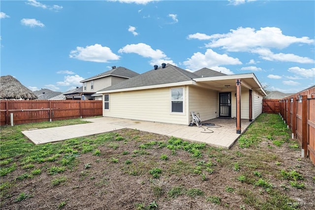 rear view of property featuring a patio