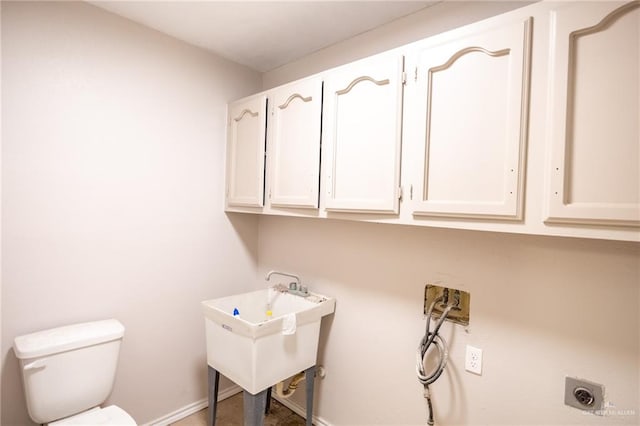 laundry room with cabinets, sink, washer hookup, and hookup for an electric dryer