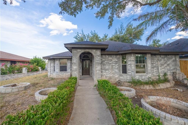 view of front of property with an outdoor fire pit