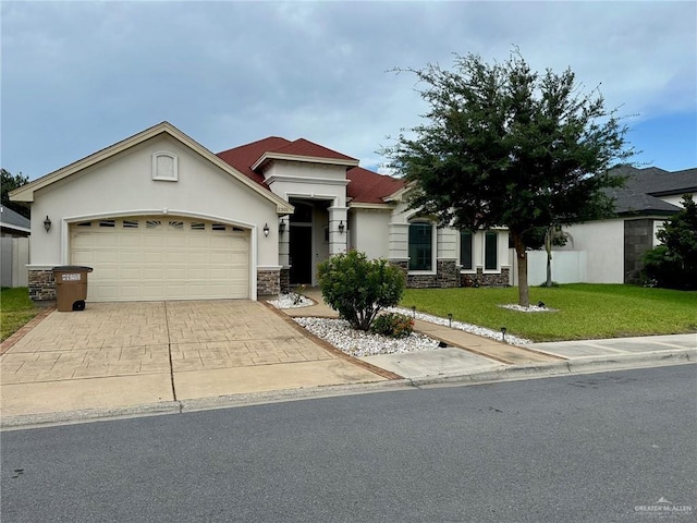 2301 Mcleod Ave, Edinburg, TX 78539 - view of front of property featuring stone siding, stucco siding, a garage, a front lawn, and concrete driveway