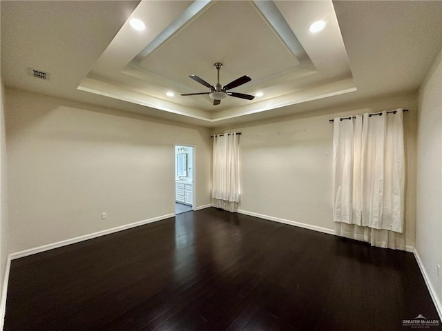 2301 Mcleod Ave, Edinburg, TX 78539 - unfurnished room with a raised ceiling, a ceiling fan, dark wood-type flooring, and recessed lighting