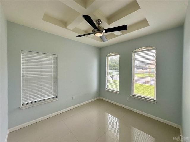 2301 Mcleod Ave, Edinburg, TX 78539 - tiled spare room featuring a ceiling fan, coffered ceiling, and a tray ceiling
