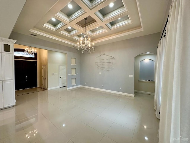 2301 Mcleod Ave, Edinburg, TX 78539 - unfurnished room featuring a chandelier, arched walkways, coffered ceiling, ornamental molding, and beam ceiling