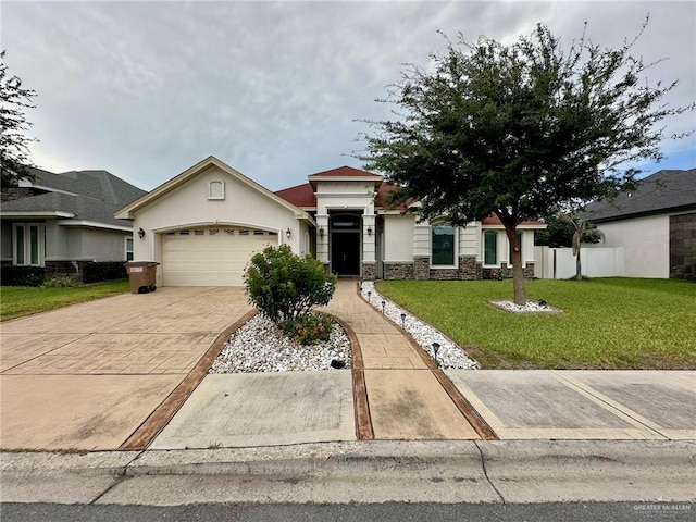 2301 Mcleod Ave, Edinburg, TX 78539 - view of front of house featuring an attached garage, stone siding, driveway, and stucco siding