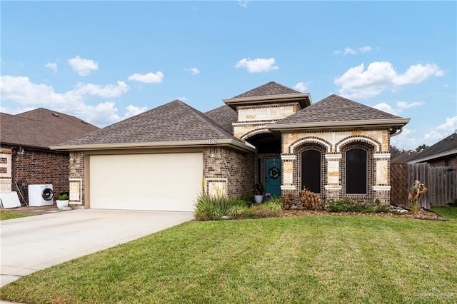 view of front of house with a garage, ac unit, and a front yard