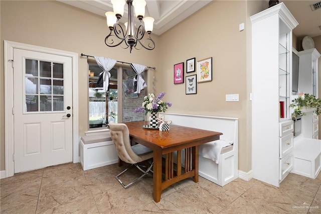 dining area featuring an inviting chandelier and breakfast area