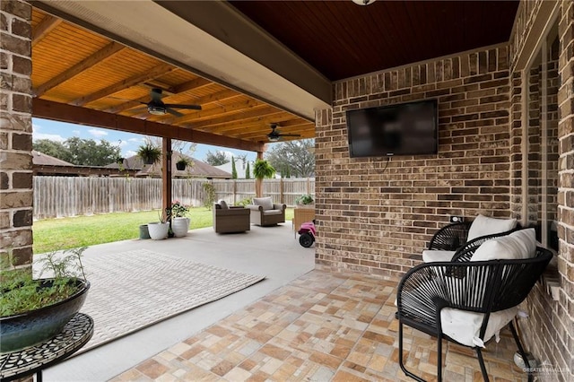 view of patio featuring an outdoor living space and ceiling fan