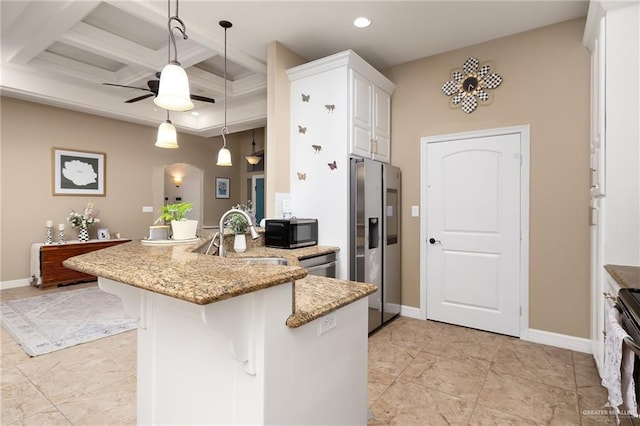 kitchen featuring appliances with stainless steel finishes, a kitchen breakfast bar, decorative light fixtures, coffered ceiling, and kitchen peninsula