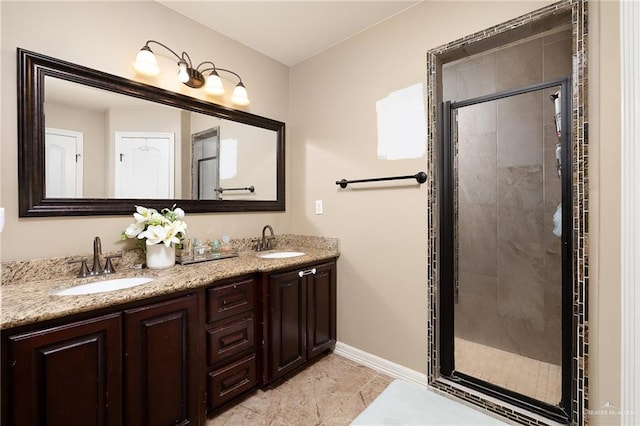 bathroom featuring vanity and a shower with door