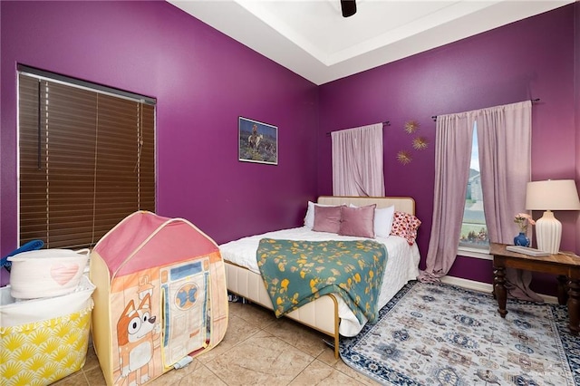 tiled bedroom with ceiling fan