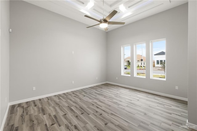 spare room featuring ceiling fan and light hardwood / wood-style flooring