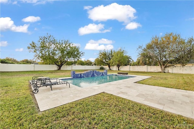 view of pool with pool water feature, a patio, and a lawn