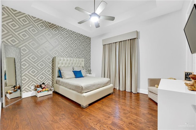 bedroom with ceiling fan and dark wood-type flooring