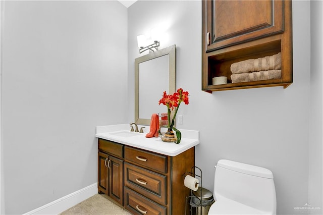 bathroom with vanity and toilet