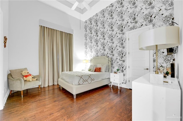 bedroom with ceiling fan and dark hardwood / wood-style flooring