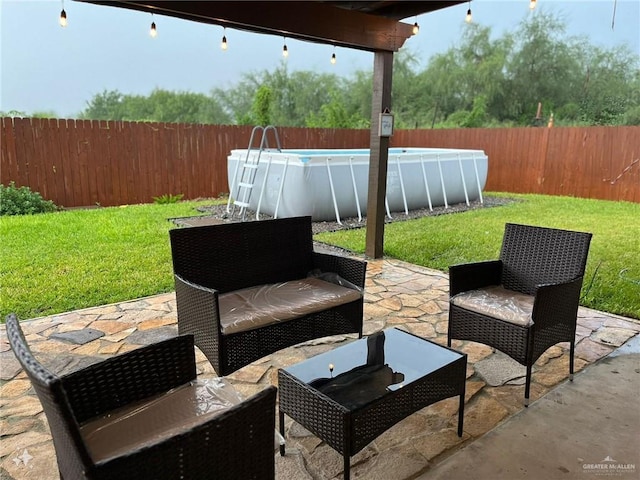 view of patio with a fenced in pool