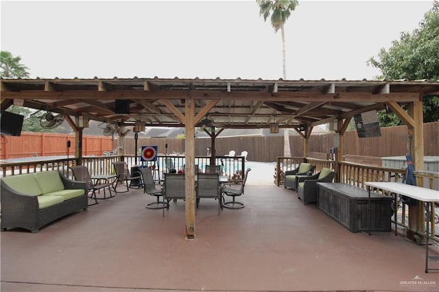 view of patio / terrace with a fenced backyard, a gazebo, and an outdoor hangout area