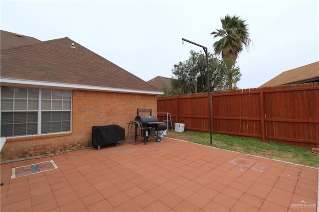 view of patio featuring area for grilling and a fenced backyard