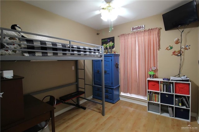 bedroom with wood finished floors