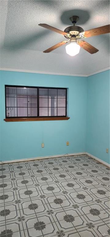 spare room featuring crown molding, ceiling fan, and a textured ceiling