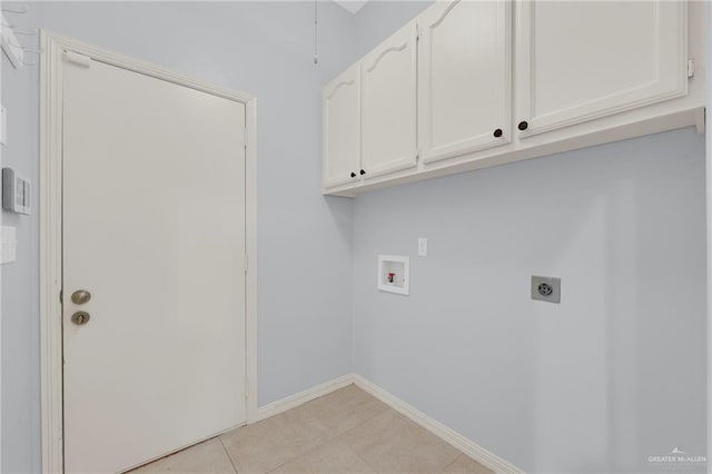 3313 Roadrunner Dr, Edinburg, TX 78541 - laundry room with electric dryer hookup, washer hookup, cabinet space, and light tile patterned floors