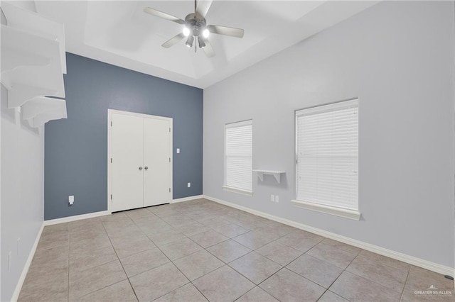 3313 Roadrunner Dr, Edinburg, TX 78541 - tiled spare room featuring ceiling fan, a raised ceiling, and a towering ceiling