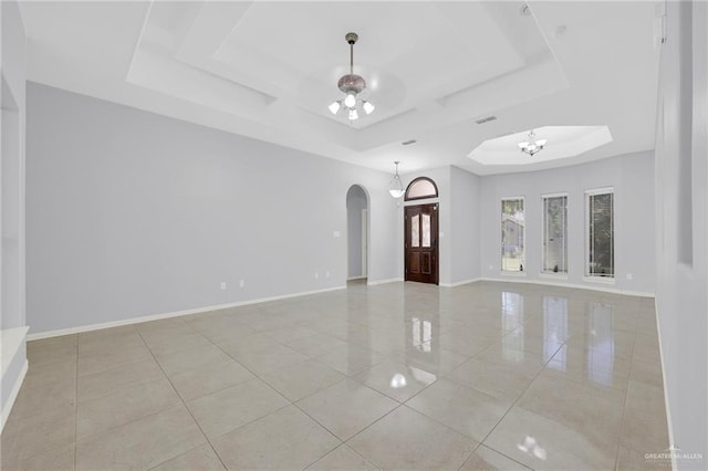 3313 Roadrunner Dr, Edinburg, TX 78541 - unfurnished room with a raised ceiling, arched walkways, light tile patterned floors, and ceiling fan