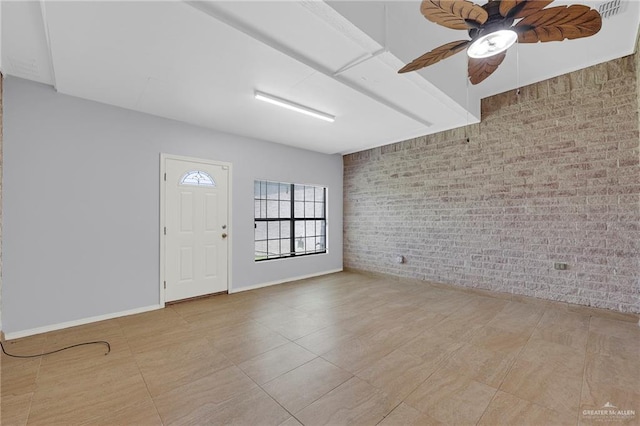 3313 Roadrunner Dr, Edinburg, TX 78541 - tiled foyer featuring ceiling fan and brick wall