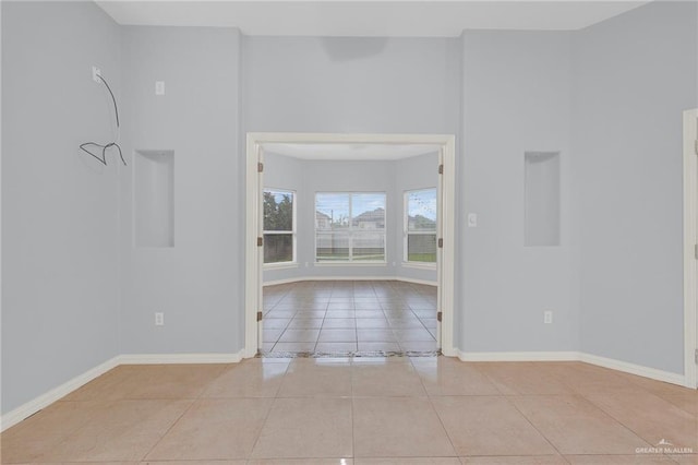 3313 Roadrunner Dr, Edinburg, TX 78541 - empty room with light tile patterned floors and baseboards