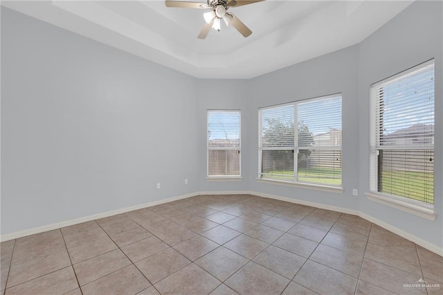 3313 Roadrunner Dr, Edinburg, TX 78541 - tiled empty room with ceiling fan and a raised ceiling
